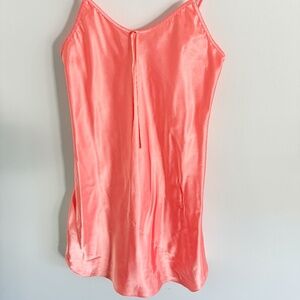 Vintage long sleeve nightgown with a snap button front closure. Features a relax